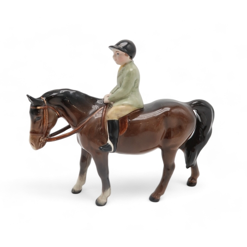 2303 - BESWICK BOY ON BROWN PONYwearing a green jacket, model 1500