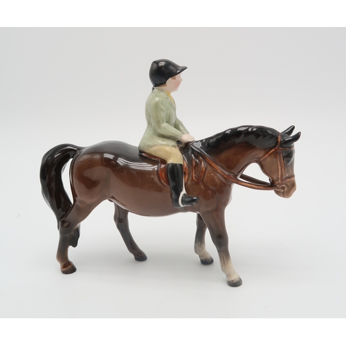 2303 - BESWICK BOY ON BROWN PONYwearing a green jacket, model 1500