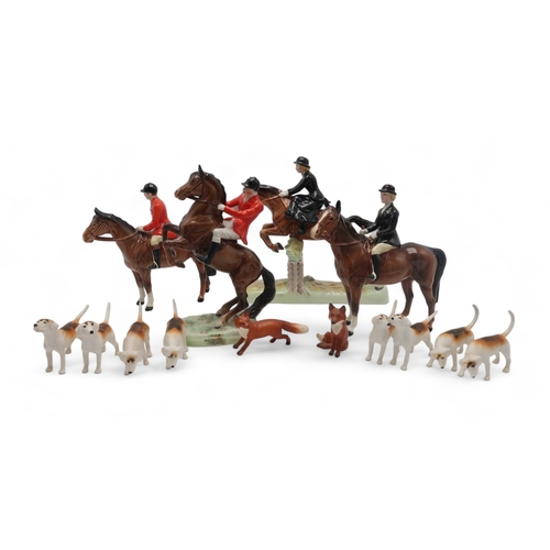 2304 - A BESWICK HUNTING GROUPincluding Huntsman on rearing horse, model 868, Huntsman on horse, model 1501... 