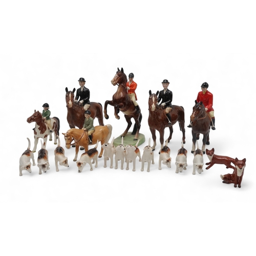 2305 - A BESWICK HUNTING GROUPincluding Girl on skewbald pony, model 1499, Boy on Palomino pony, model 1500... 