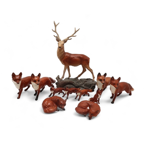 2308 - A BESWICK MATT STAG ON ROCKmodel 2629, together with assorted fox figures including  four model 1016... 