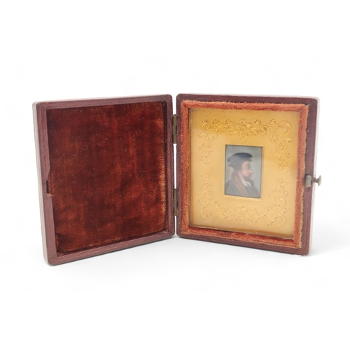 2309 - AN ENAMEL MINIATURE PORTRAIT OF A MANpossibly John Calvin, with gilt metal surround and housed withi... 