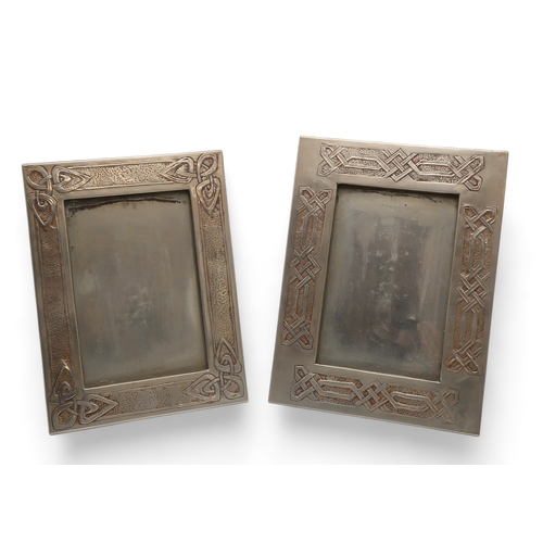 2315 - A GLASGOW SCHOOL WHITE METAL FRAMEdecorated in relief with Celtic knotwork panels, 28.5cm x 21.5cm t... 