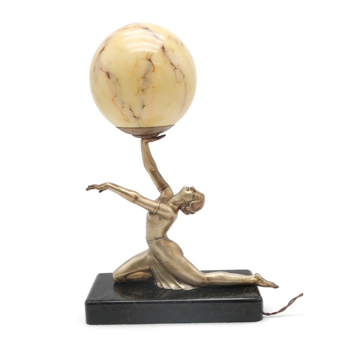 2319 - AN ART DECO GILDED METAL LADY LAMPmodelled kneeling with arms outstretched, balancing a mottled glas... 