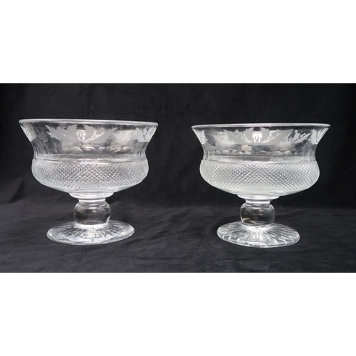 2321 - TWO EDINBURGH CRYSTAL THISTLE BOWLSwith diamond cut body with etched thistle band to rim, 17cm high,... 