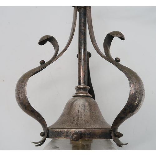 2326 - AN ARTS AND CRAFTS SILVERED BRASS HALL LIGHTwith three S scrolls with hammed decoration and cut glas... 