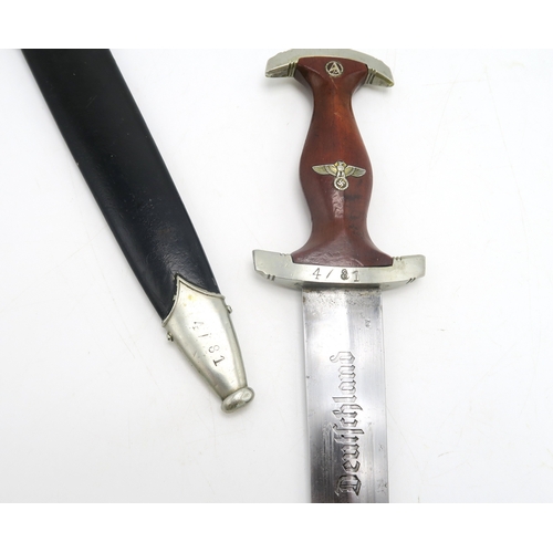 2620 - A WW2 GERMAN THIRD REICH SA DAGGER BY W.K.C, SOLINGENThe approx. 22cm blade etched 