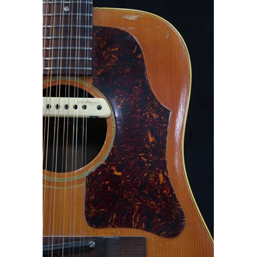 2678 - GIBSON A vintage 1960's Gibson B-45 12 string acoustic guitar with natural finish and  tortoise shel... 