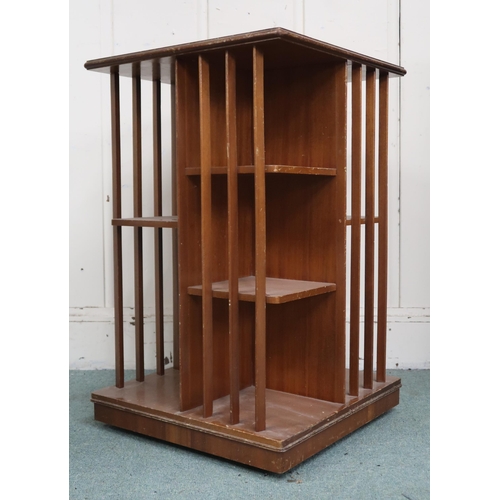 17 - An early 20th century mahogany revolving bookcase with square top over asymmetrical shelves with bat... 