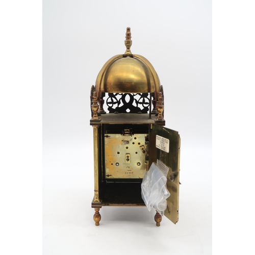 171 - A French brass lantern clock with key