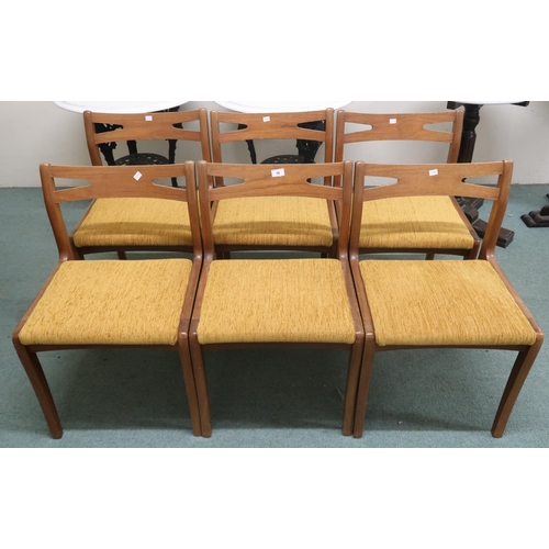 19 - A set of six mid 20th century teak Nathan dining chairs with shaped pierced splats over upholstered ... 