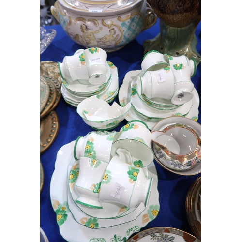 193 - A Noritake teaset decorated with Geishas, together with a Paragon China teaset painted with green fl... 