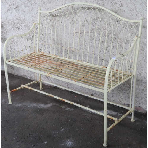 20F - A 20th century yellow painted metallic garden bench with wire work back and sides over slatted seat,... 