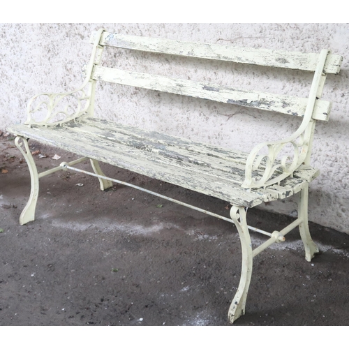 20K - A 20th century yellow painted garden bench with scrolled cast metal ends joined by wooden slats, 69c... 