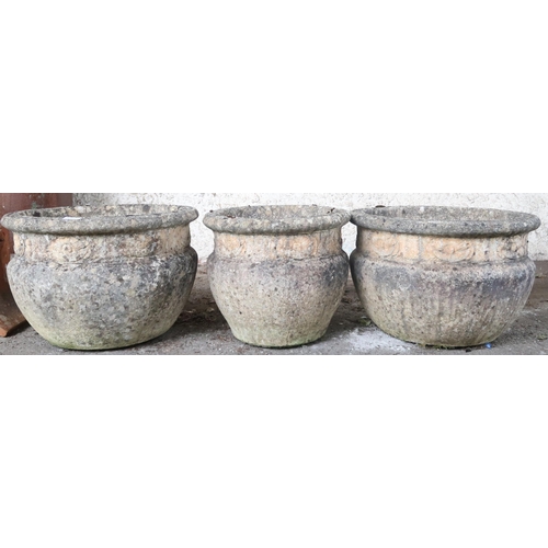 20L - A lot comprising a pair of 20th century reconstituted stone garden urns, 32cm high x 47cm diameter a... 