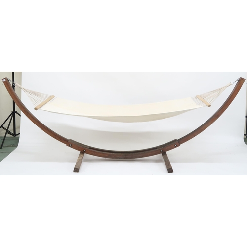 20N - A contemporary garden/conservatory hammock with cream linen hammock suspended from bowed teak frame,... 