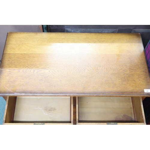 25 - A 20th century oak two over three chest of drawers with stylized drawer pulls, 98cm high x 99cm wide... 