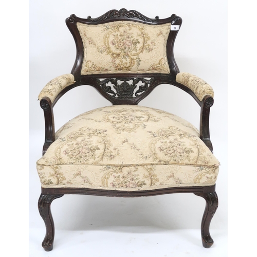 29 - A Victorian ebonised parlour armchair with floral upholstery applied to back, arms and seat on cabri... 