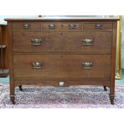 36 - An early 20th century oak Arts & Craft chest of drawers with three short over two long drawers o... 