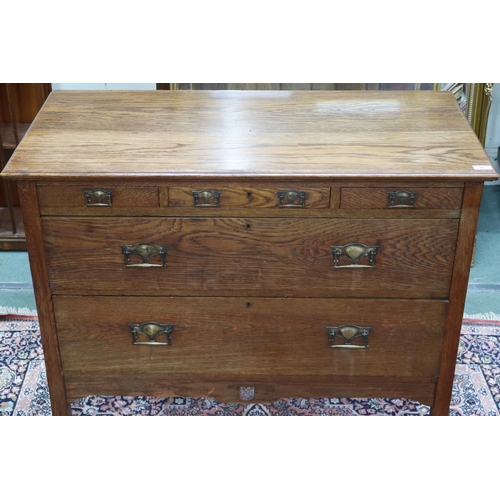 36 - An early 20th century oak Arts & Craft chest of drawers with three short over two long drawers o... 