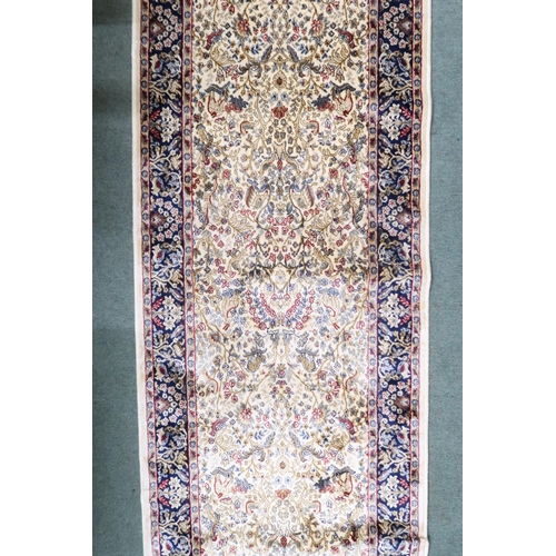 48 - An ivory ground full pile cashmere runner with floral/foliate allover tree of life design decorated ... 