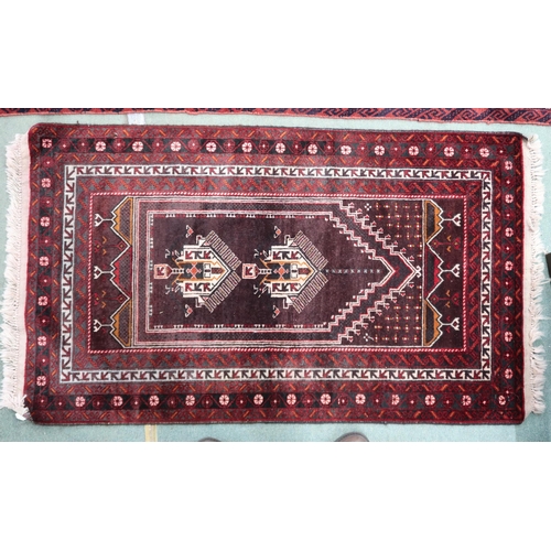 55 - A rich multicoloured ground fine handwoven Afghan Baluch nomadic rug with geometric prayer style cen... 