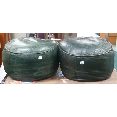 67 - A pair of 20th century green leather upholstered cylindrical form pouffe footstools, approximately 2... 