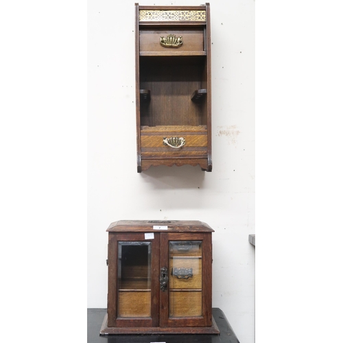 7 - A lot comprising Victorian oak smokers cabinet with pair of glazed doors concealing two short over o... 