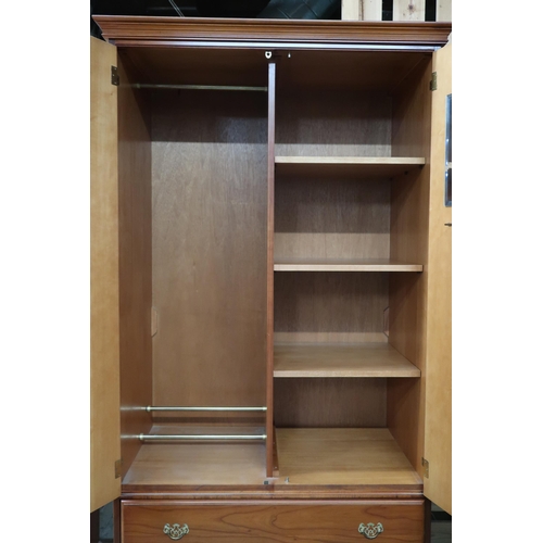 71 - A contemporary Younger two door wardrobe with moulded cornice over pair of doors over two long drawe... 