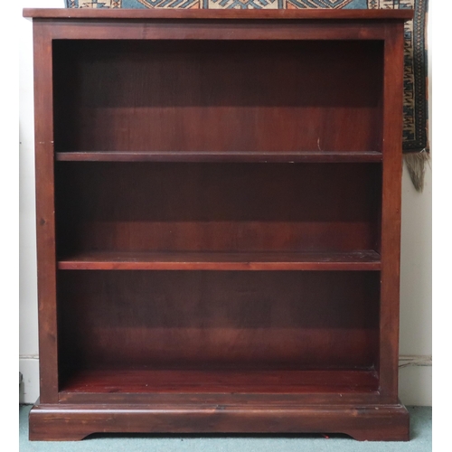 9 - A contemporary stained teak veneered open bookcase with two adjustable shelves on plinth base, 109cm... 