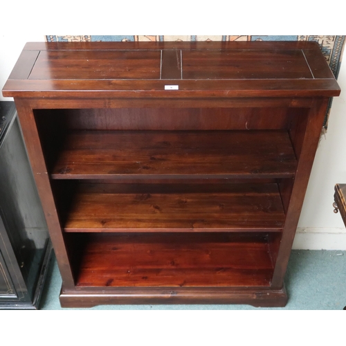 9 - A contemporary stained teak veneered open bookcase with two adjustable shelves on plinth base, 109cm... 