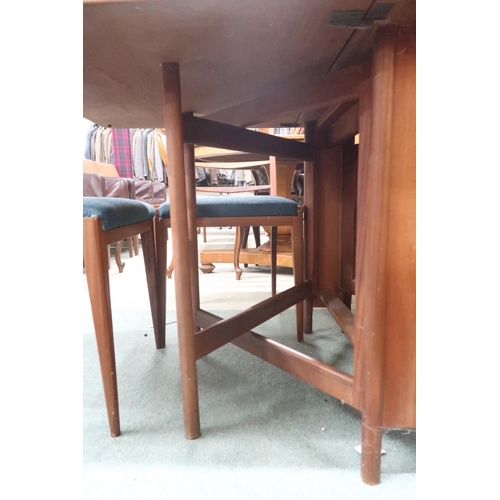 94 - A mid 20th century teak A.H McIntosh gateleg dining table and six chairs, table, 73cm high x 150cm l... 