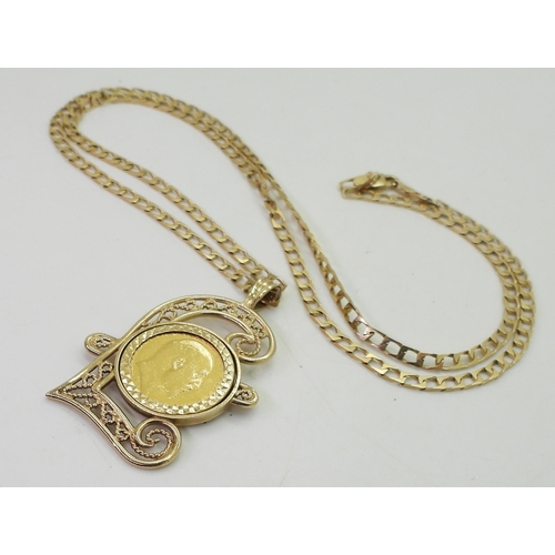 701 - A 1903 gold half sovereign in a 9ct gold filigree Pound sign shaped pendant mount on a 60cm 9ct gold... 