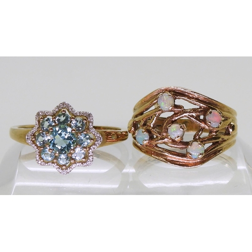 707 - A 9ct gold opal ring, size Q, a blue topaz and diamond flower ring, size S1/2, weight together 6.2gm... 