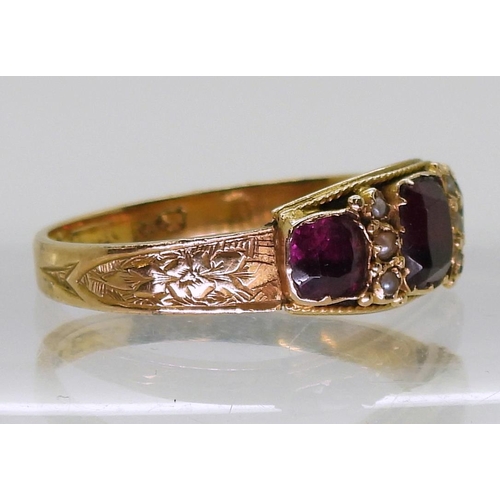 708 - An 18ct gold Victorian garnet and pearl ring, size R, weight 2.1gms