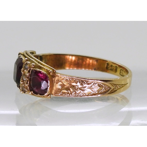 708 - An 18ct gold Victorian garnet and pearl ring, size R, weight 2.1gms