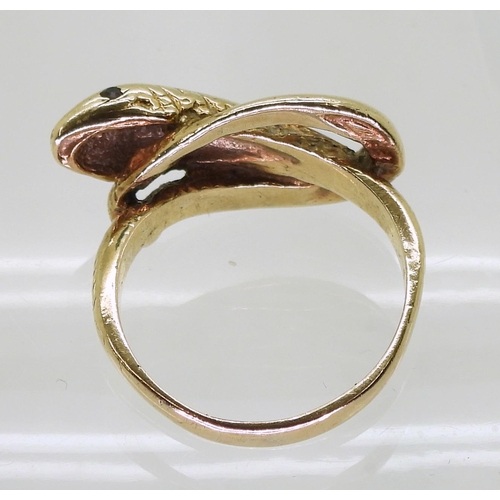 709 - A 9ct gold snake ring with garnet eyes, hallmarked London 1980, size O1/2, weight 5.6gms