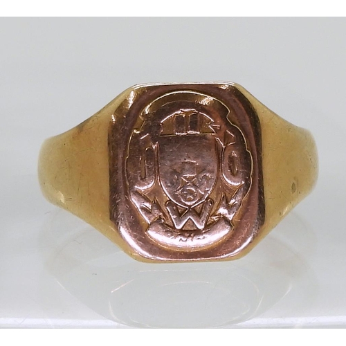 712 - A 10K gold signet ring, size W, weight 5.7gms