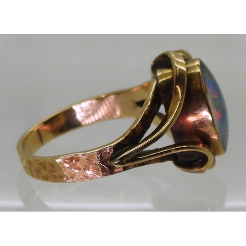 713 - A 10K gold ring set with an opal doublet, size O1/2, weight 4.5gms