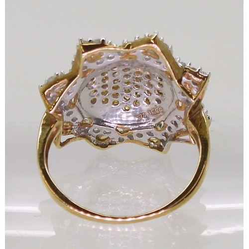 722 - A 9ct gold yellow and white diamond sunflower ring, size J1/2, weight 3gms