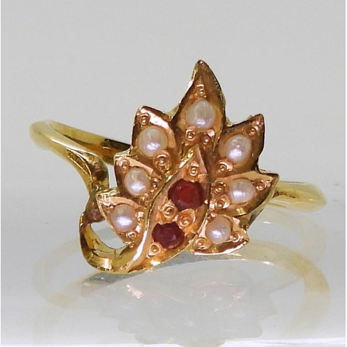 727 - A bright yellow metal leaf shaped ring, set with red gems and pearls, size M, weight 3.3gms