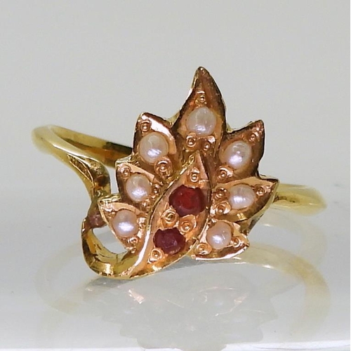 727 - A bright yellow metal leaf shaped ring, set with red gems and pearls, size M, weight 3.3gms