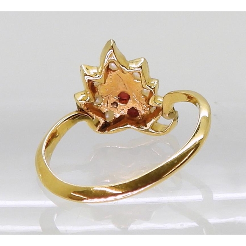 727 - A bright yellow metal leaf shaped ring, set with red gems and pearls, size M, weight 3.3gms