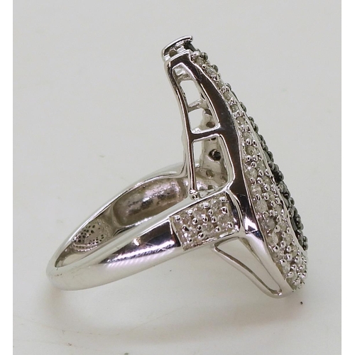 730 - A 9ct white gold black and white diamond statement ring, size O, weight 7.2gms