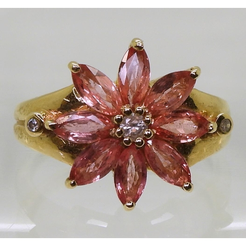 740 - An 18ct gold pink sapphire and diamond flower ring, size O, weight 6.1gms