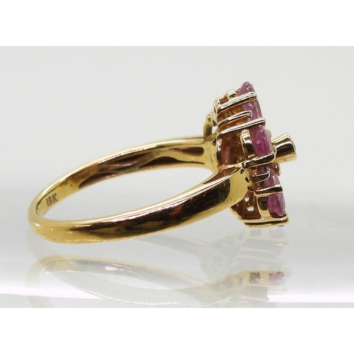 742 - An 18ct gold pink sapphire and diamond ring, size L1/2, weight 3.4gms