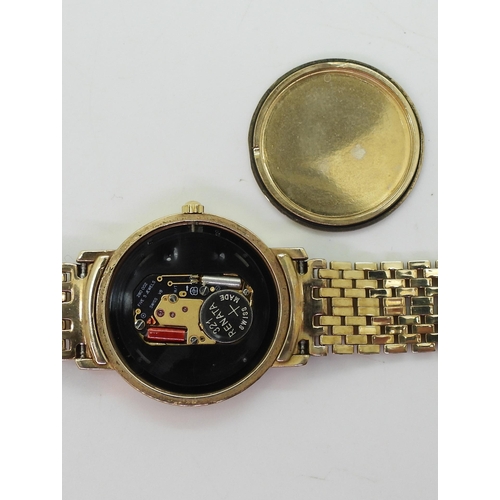 767 - A 9ct gold Geneve quartz ladies watch, weight including mechanism 30gms