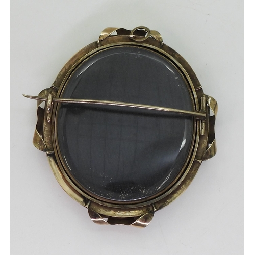 771 - A yellow metal Ambrotype locket brooch, dimensions 7cm x 6.3cm, weight 39.8gms