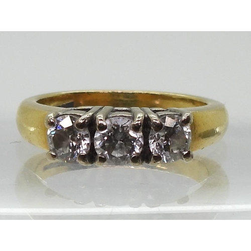 773 - An 18ct gold three stone diamond ring, set with estimated approx 0.75cts, finger size K1/2, weight 5... 