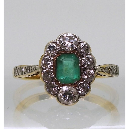 774 - An 18ct gold diamond and emerald ring, set with estimated approx 0.48cts of brilliant cut diamonds, ... 